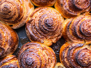 Fototapeta premium top view of homemade fresh baked cinnamon buns close up