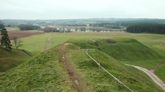 AERIAL: Flying of Top of Mound in Kernave Archaeological site on a Gloomy Autumn Day