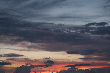 clouds slowly float in the sky during sunset