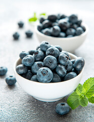 Blueberries on concrete background