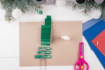 Step-by-step Greeting card Christmas tree tutorial. Step 16: Glue back side, pressing down...
