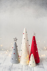 Handmade Christmas trees. Yarn wrapped cone trees and garland. Craft decorations to decorate your home during the holidays