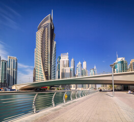 Obraz na płótnie Canvas Day view of Dubai Marina bay with bridge, UAE