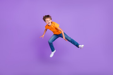 Full length body size photo boy jumping up happy careless overjoyed isolated pastel violet color background