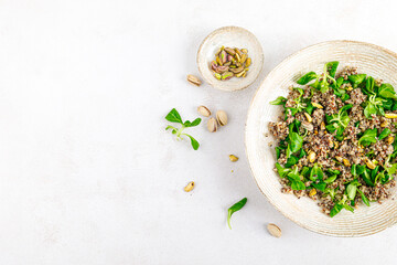 Quinoa with corn salad and pistachios. Healthy food. Top view.
