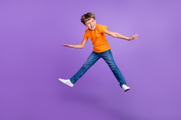 Fototapeta na wymiar Full length body size photo boy in stylish outfit jumping high careless isolated pastel purple color background