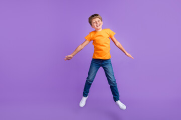 Fototapeta na wymiar Full length body size photo boy in stylish outfit jumping up isolated pastel purple color background