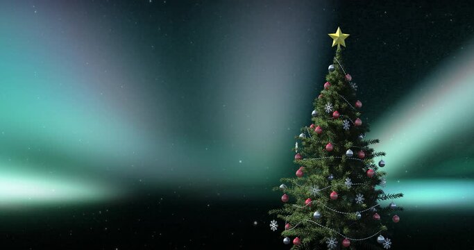 Animation of christmas tree over aurora