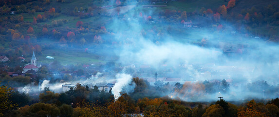Smoke over rural landscape