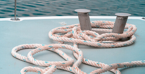 Rope on the deck of the boat for mooring at the pier