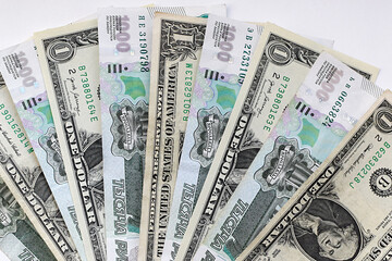 US dollars with Russian rubles, background. Financial crisis, ruble devaluation concept. Flat lay.