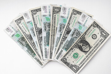 US dollars with Russian rubles, background. Financial crisis, ruble devaluation concept. Flat lay.