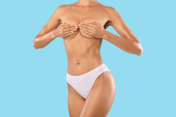 Fototapeta na wymiar Fit Topless Female Covering Breast With Hands