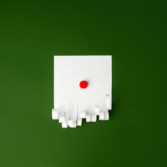 Creative DIY idea for kids, Santa Claus with mustache made from paper on green  background. Copy...