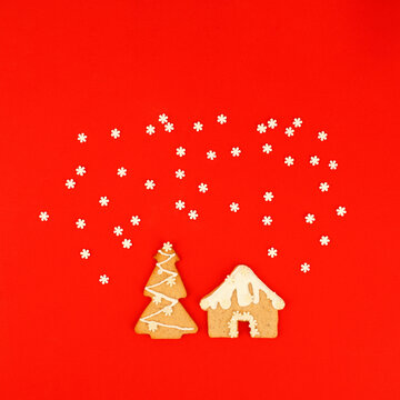 Happy New Year 2022. Christmas, winter holidays concept. Gingerbread cookies tree, sweet house home and snowflake set confetti on traditional red background, fleyer, invitation, greeting card, banner