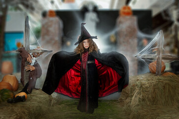 a little girl in a terrible witch costume for Halloween. Sweets or life
