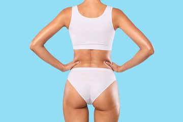 Fototapeta na wymiar Rear Back View Of Young Slim Woman In White Underwear
