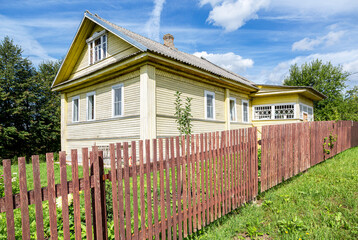 Old rural wooden house in russian village in summer - obrazy, fototapety, plakaty