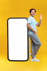 Man leaning on white empty smartphone screen showing ok gesture