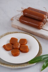 traditional dessert made from glutinous rice cake and palm sugar named dodol jenang in white background