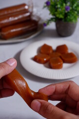 traditional dessert made from glutinous rice cake and palm sugar named dodol jenang in white background