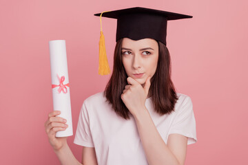 Photo of young girl hand touch chin look empty space think plan clever student graduate isolated...