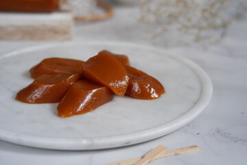 traditional dessert made from glutinous rice cake and palm sugar named dodol jenang in white background