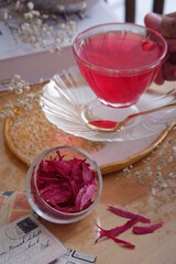 a cup of pink herbal tea