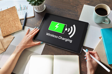 Wireless charging icons and progress bar on device screen.