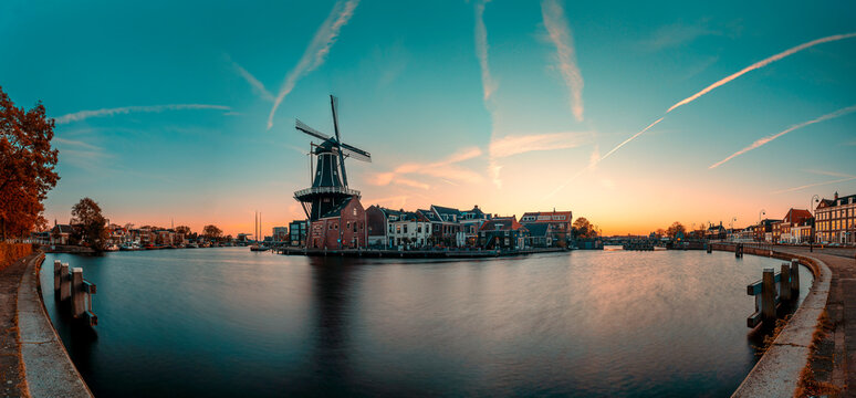High resolution panorama image of the Adriaan windmill along the Spaarne river in Haarlem at sunrise