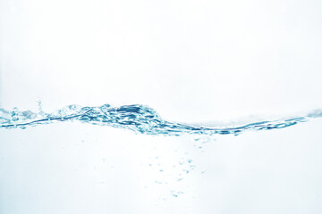 the bubbling and rippling water surface from the side view isolated on white. abstract liquid...