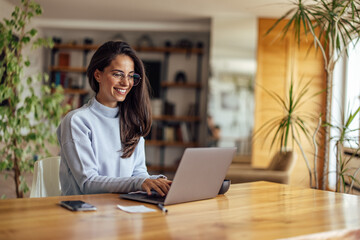 Smiling young woman, helping her business prosper