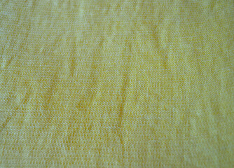 Light yellow natural linen fabric texture for backgrounds. Closeup  