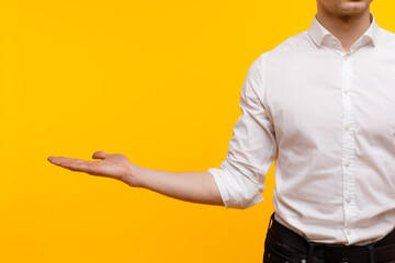 Young businessman is showing the word. Your text here