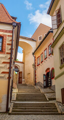 Fototapeta na wymiar Castle Stairs - a narrow historical street with steps near the Cesky Krumlov Castle, Czech republic