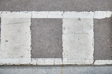 Asphalt texture of the street. Traffic markings. White paint. Gray texture, asphalt or cement with marks. Texture for matte painting.