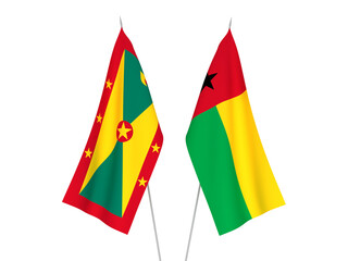 National fabric flags of Grenada and Republic of Guinea Bissau isolated on white background. 3d rendering illustration.
