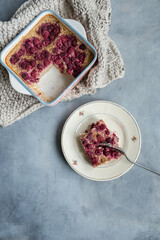 oat porridge with raspeberries topping on grey background