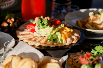 Cold appetizers on the plate on a buffet table. High quality photo