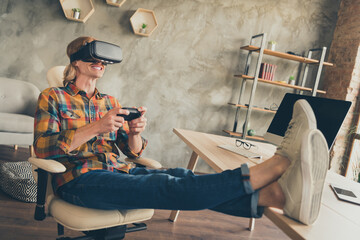 Photo portrait man in vr glasses checkered shirt playing video games with joystick after hard day