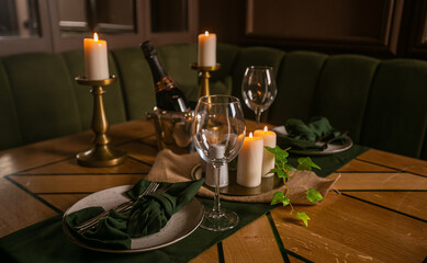 two spare glasses and candle light at the restaurant