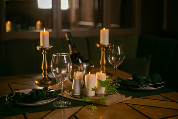 two spare glasses and candle light at the restaurant