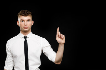 Young businessman is showing the word. Your text here