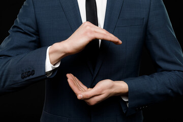 Young businessman is showing the word. Your text here