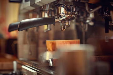 Close-up view of an espresso apparatus making a coffee. Coffee, beverage, bar
