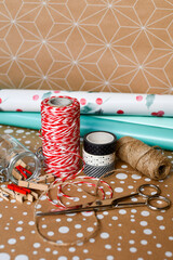 gift wrapping twine, mini clothespins, whasi tape and colored wrapping paper