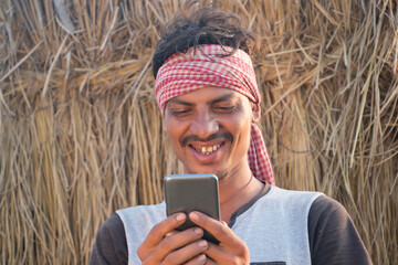 Indian Rural man Holding mobile phone