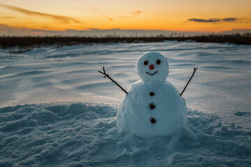 cute snowman and yellow sunset