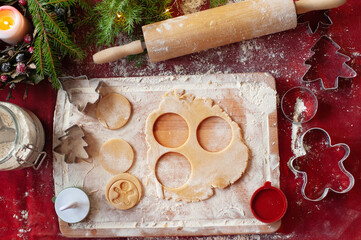 Top view of dough, cookie cutters and Christmas decor, home made cookies, Making christmas...