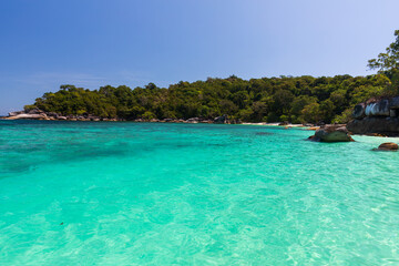 The beautiful and secluded Moken Bay of Boulder Island in Myanmar covering with so many boulders on the beach